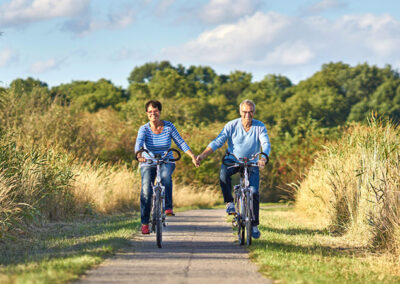 A happy couple cycling through the Spree Forest